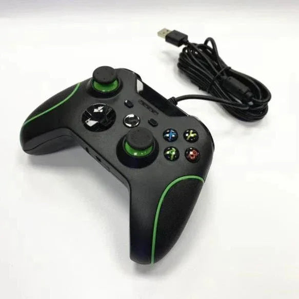 Wired black gaming controller with green accents and USB connector on white background