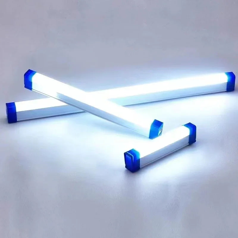Bright LED light bars with blue end caps on a white background, modern electronic lighting